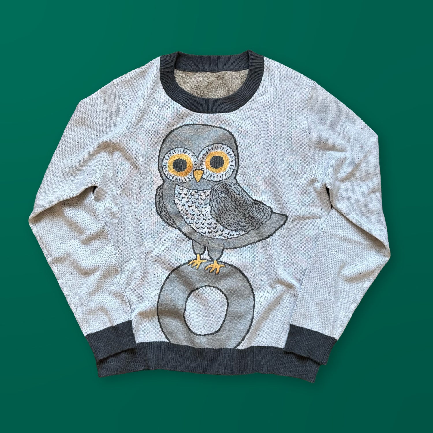 Owl on a Vowel graphic knit sweater in light gray — cute owl design knitted by artist Jedd