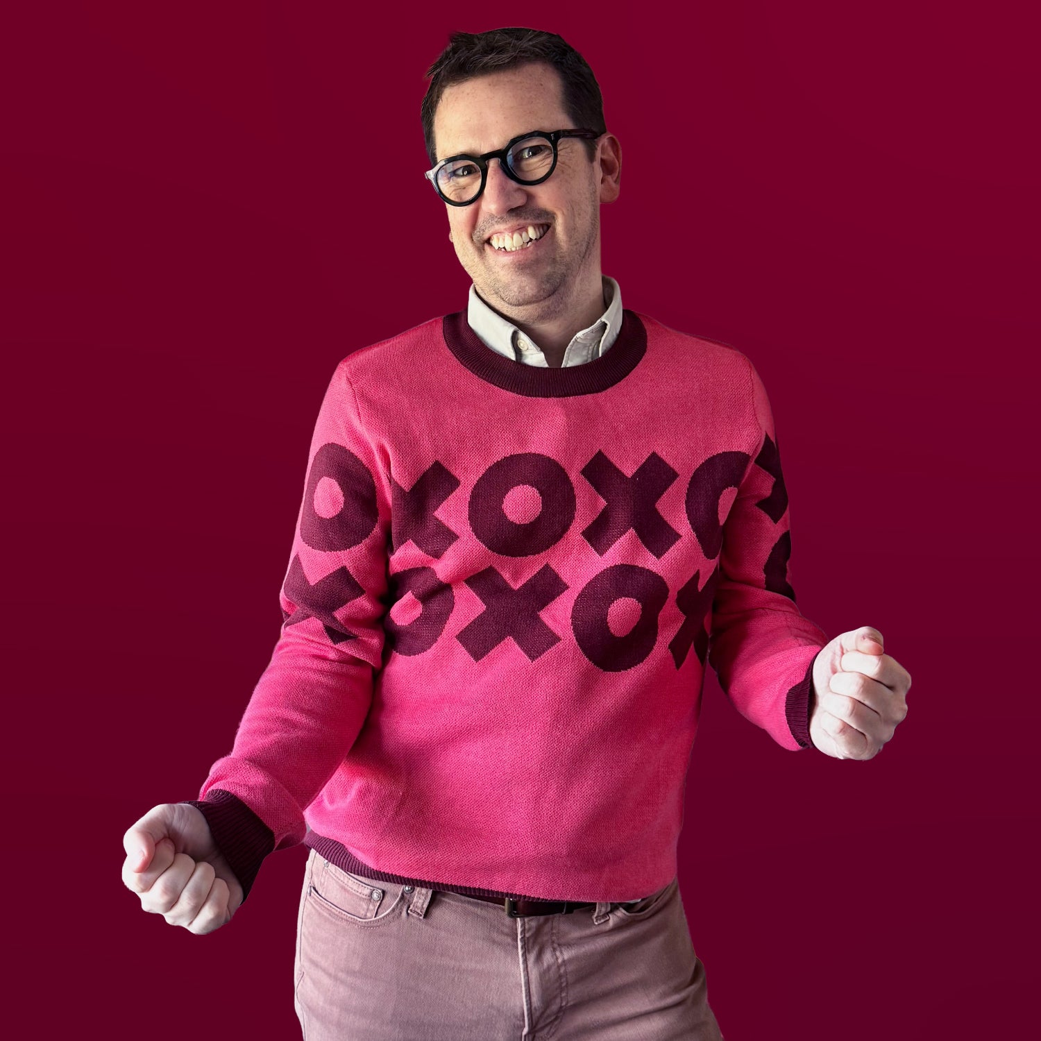Artist Jedd wearing the XOXO graphic knit sweater