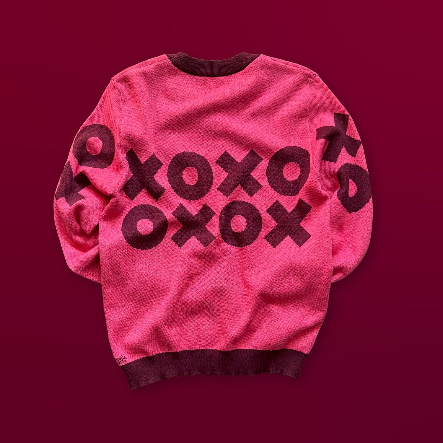 Back view of the XOXO bright pink graphic knit sweater by Jedd — artist-made designer fashion