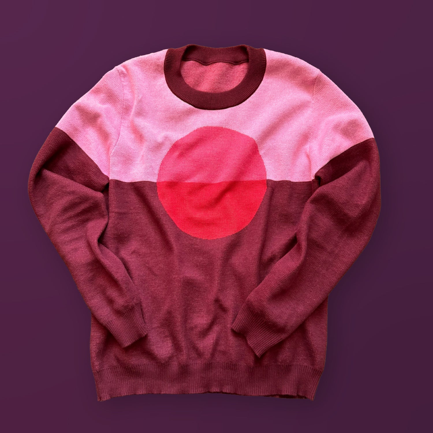 Self Centered graphic knit sweater in burgundy — artist-designed centered heart motif knitwear by Jedd