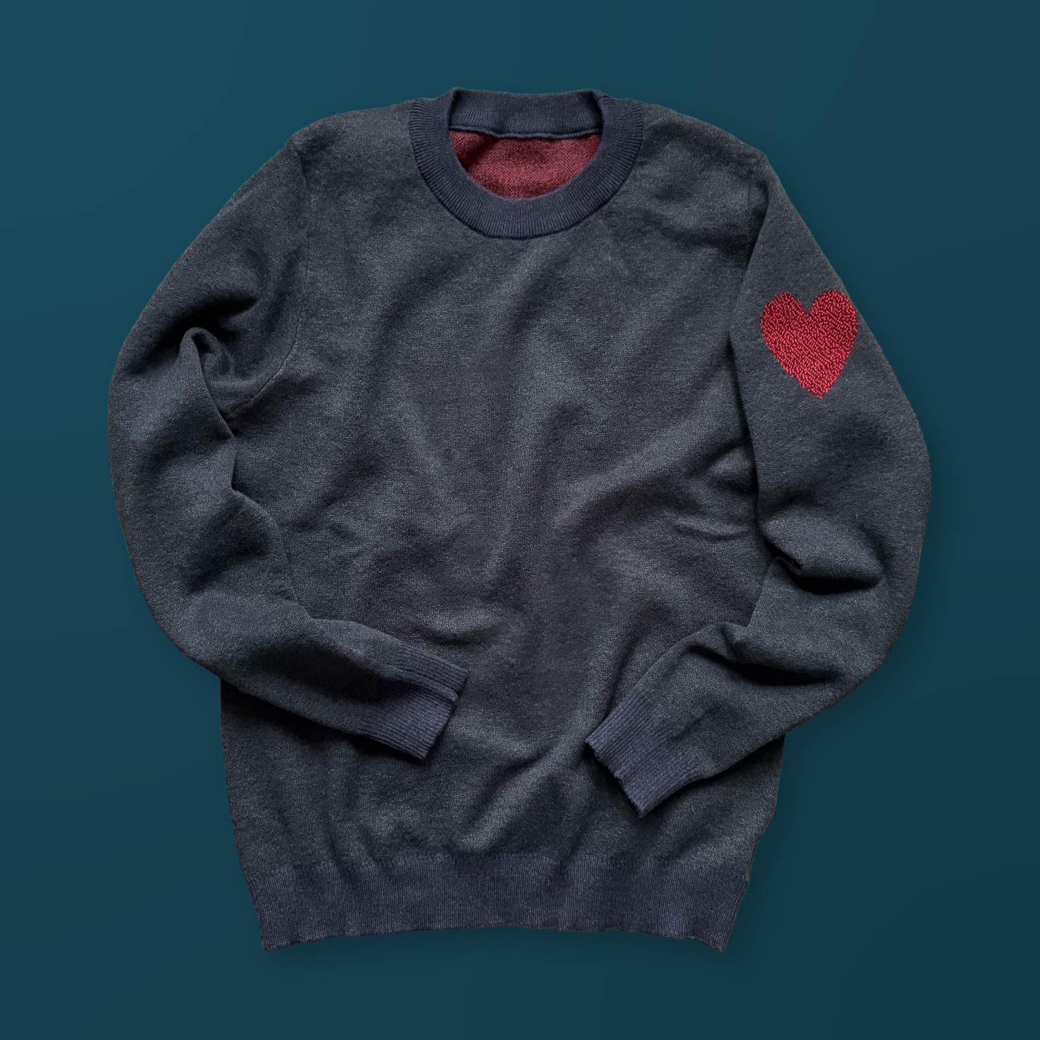 Heart On My Sleeve graphic knit sweater in heather deep sea blue — distinctive artist-made fashion with heart on sleeve