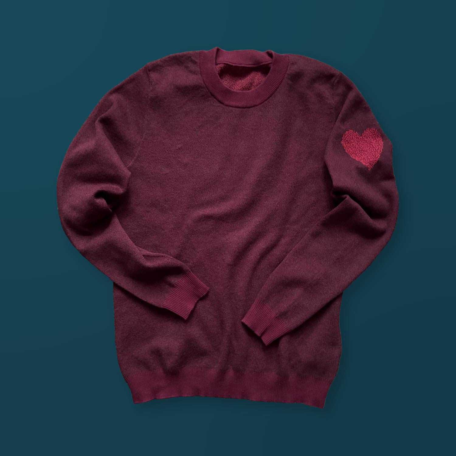 Heart On My Sleeve graphic knit sweater in heather burgundy — cozy designer knitwear by Jedd with heart sleeve detail