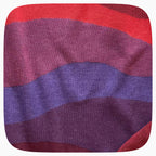 A red sweater with a patter that fades to darker red at the bottom.