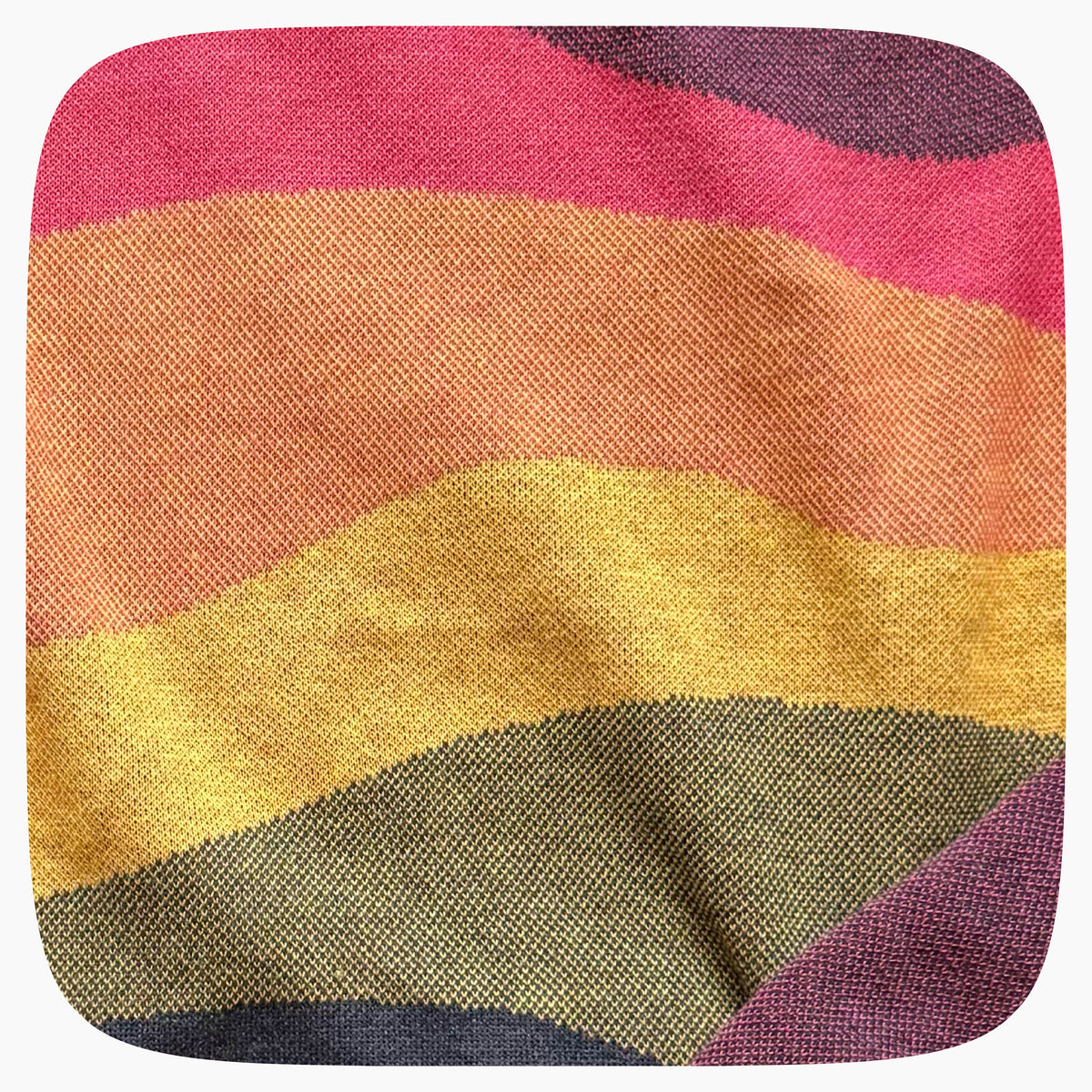 A pink sweater with a patter that fades to darker blue at the bottom.
