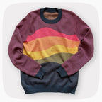 A pink sweater with a patter that fades to darker blue at the bottom.