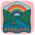 Detail of a pink t-shirt with a large illustrated design showing a river, a ferry, a castle and a rainbow that is labeled Newburgh.