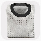 A graphic knit sweater with a pattern that looks like notebook paper.
