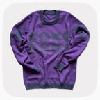 A purple graphic knit sweater with a dark red XOXO pattern across the chest.