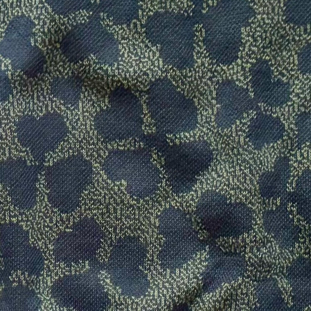 Close-up of the knitted four leaf clover design by Jedd — lucky charm jacquard knitwear detail