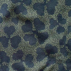 Close-up of the knitted four leaf clover design by Jedd — lucky charm jacquard knitwear detail