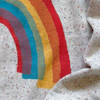 Close-up of the knitted rainbow design on the Over the Rainbow sweater by Jedd — colorful jacquard knitwear detail
