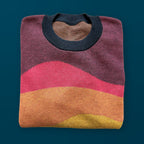 Folded Horizons graphic knit sweater in sunset — cozy layered knit design by artist Jedd