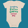 Beige baby onesie with colorful text that says Somebody on Planet Earth Loves me