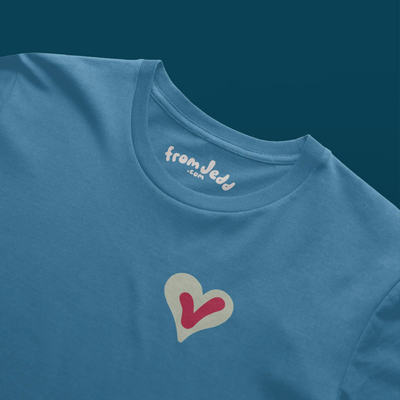 Detail of the collar on a blue t-shirt with a heart and a voting check mark design and an inside neck logo that says From Jedd