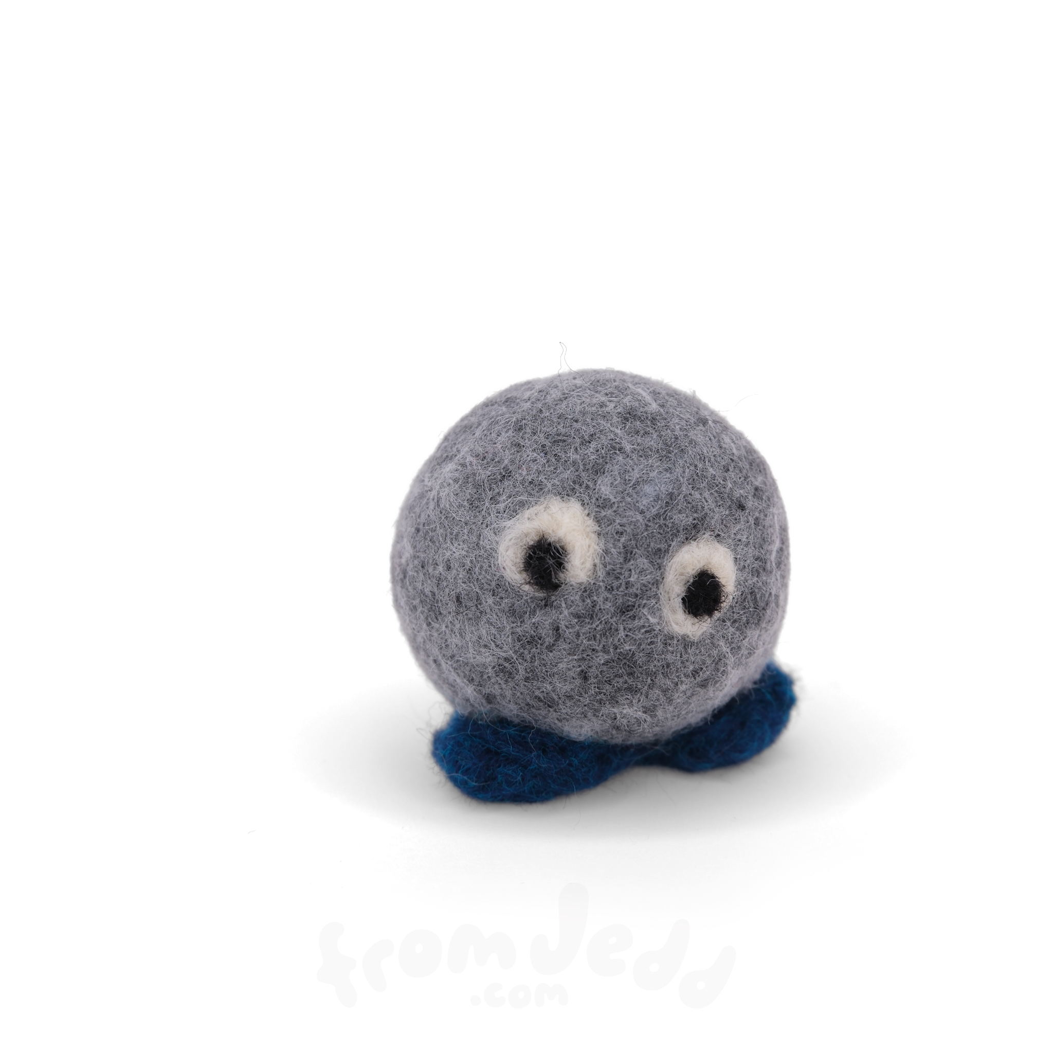 A small felt plush sculpture with a round gray body, white and black eyes, and dark blue feet, photographed on a clean white background.