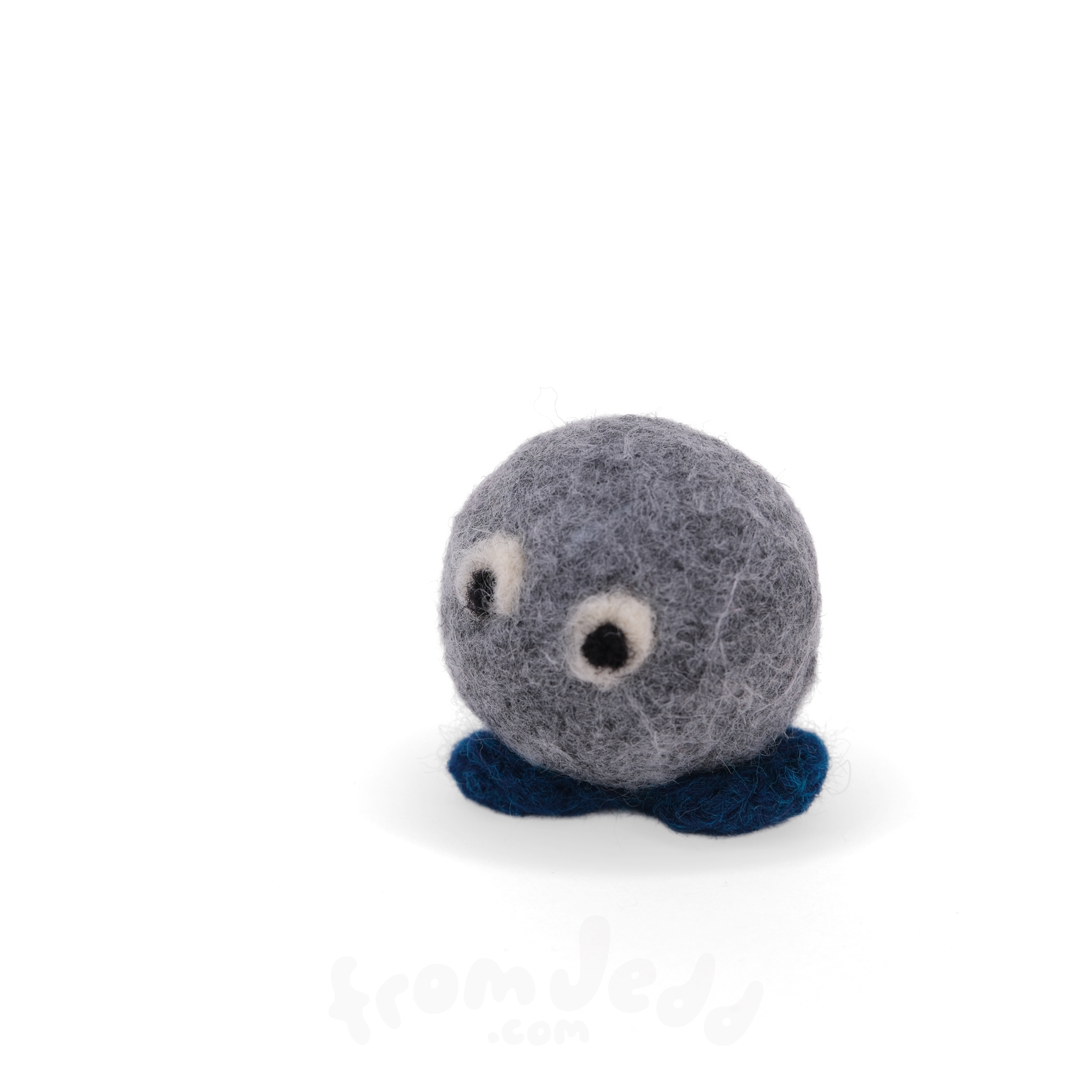A small felted wool sculpture character with a round gray body, dark blue feet, and two white-and-black bead eyes, photographed on a clean white background.