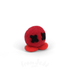A small red felt octopus toy with black stitched eyes, photographed on a clean white background.