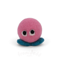 A pink felt creature with two eyes and teal feet.
