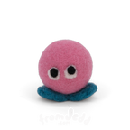 A pink felt creature with two eyes and teal feet.
