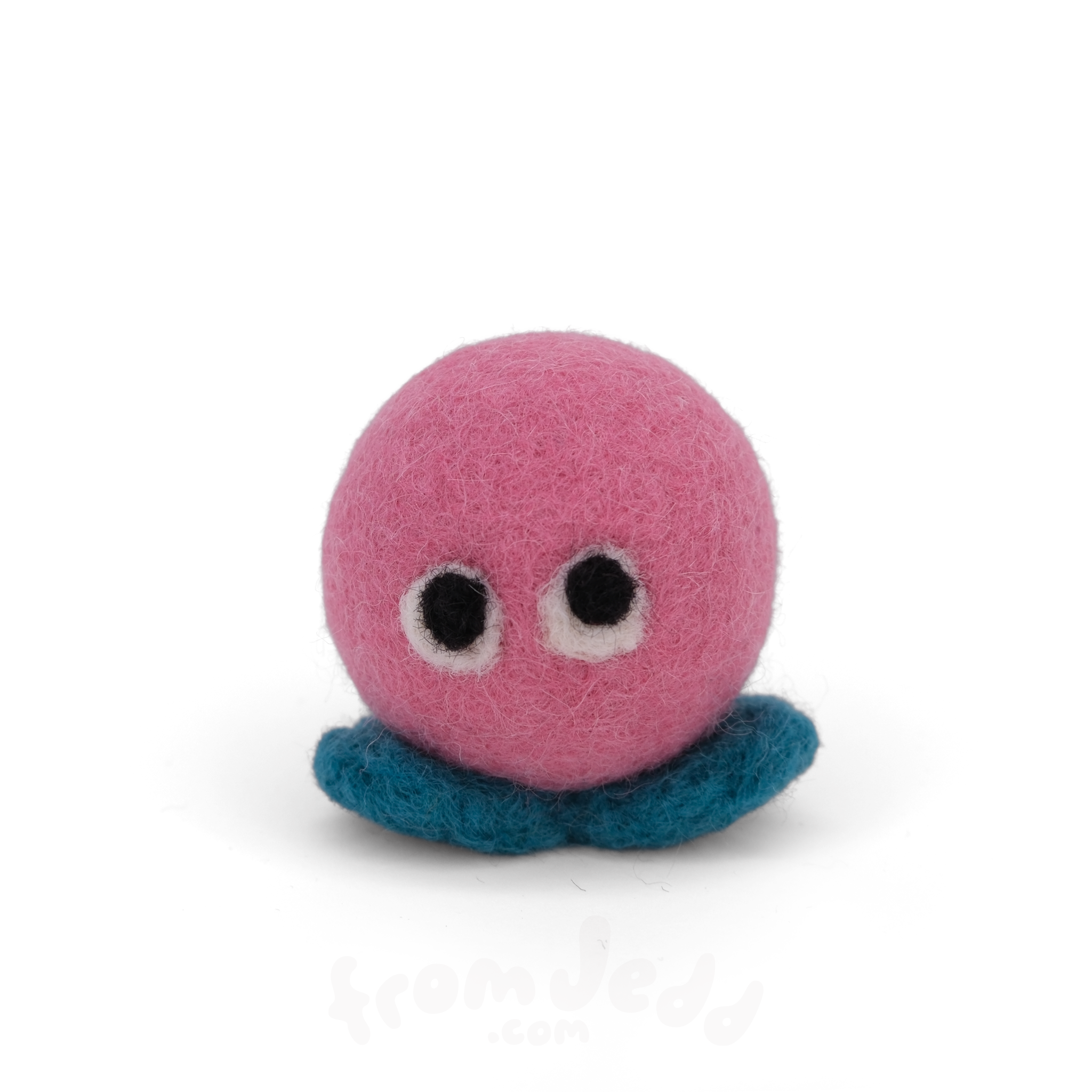 A pink felt creature with two eyes and teal feet.