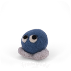 A blue felted creature with eyes looking up and grey feet.