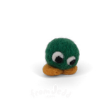 A small felted wool character toy with a round green head, large white eyes with black pupils, and a rounded orange base, photographed on a clean white background.