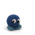 A blue felted creature with big eyes and teal feet.