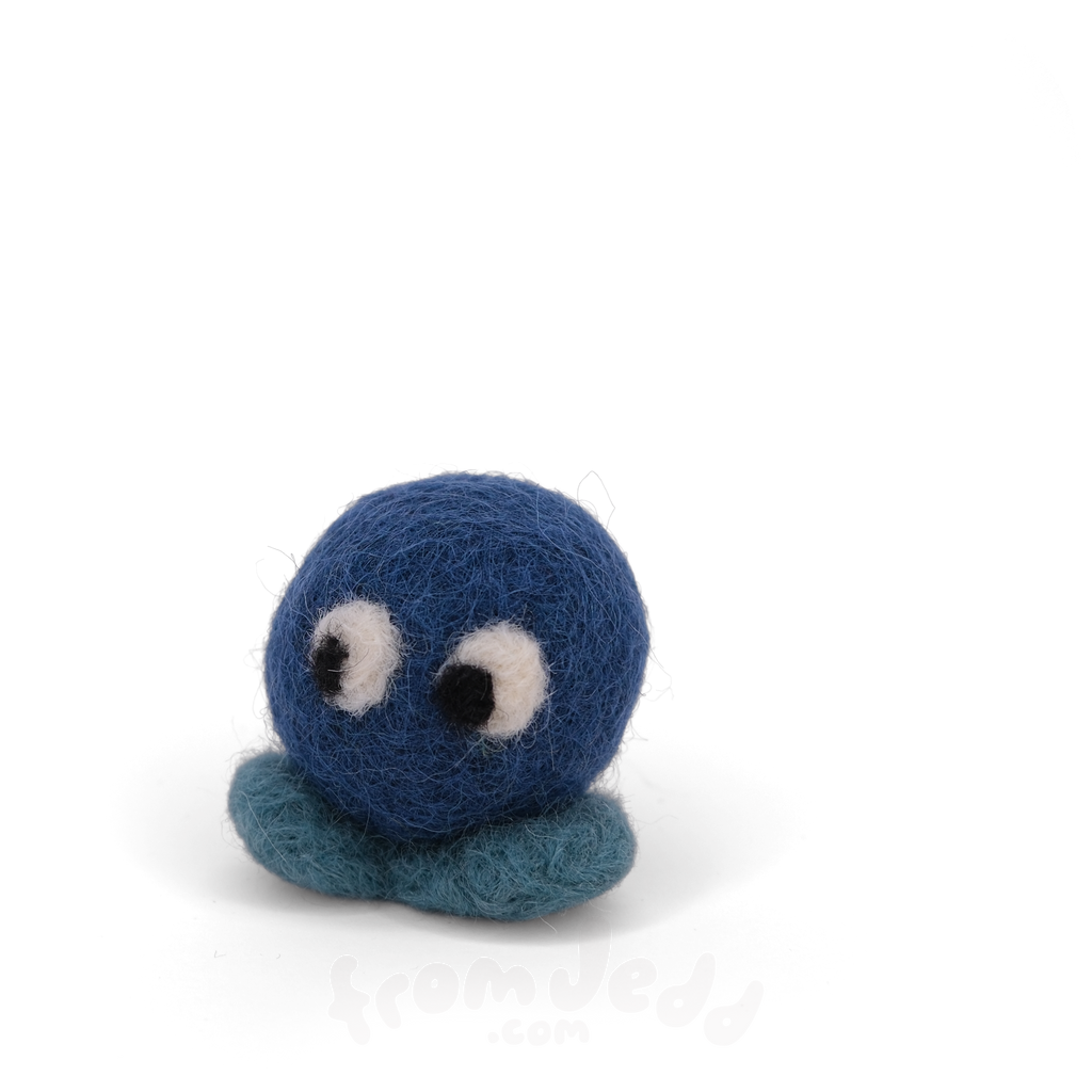 A blue felted creature with big eyes and teal feet.